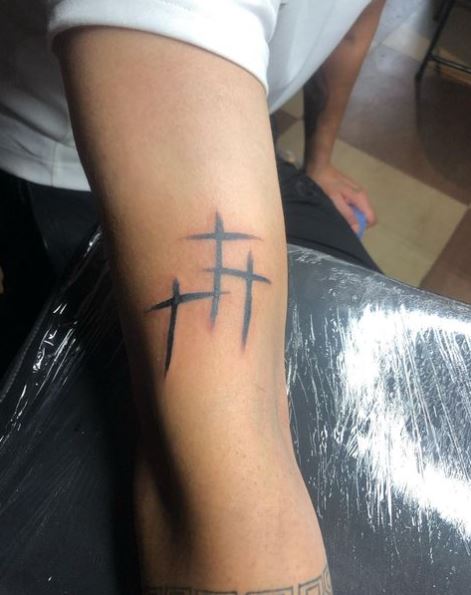 Simple Three Cross Arm Tattoo