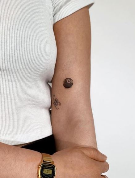 Tiny 8 Ball Arm Tattoo