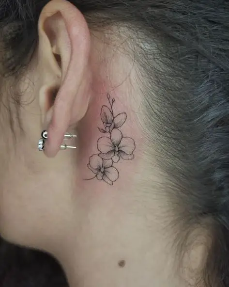 Tiny Orchid Flowers Tattoo Behind the Ear