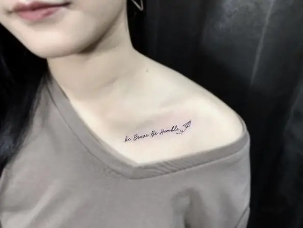 Tiny Paper Plane and Life Quote Collarbone Tattoo