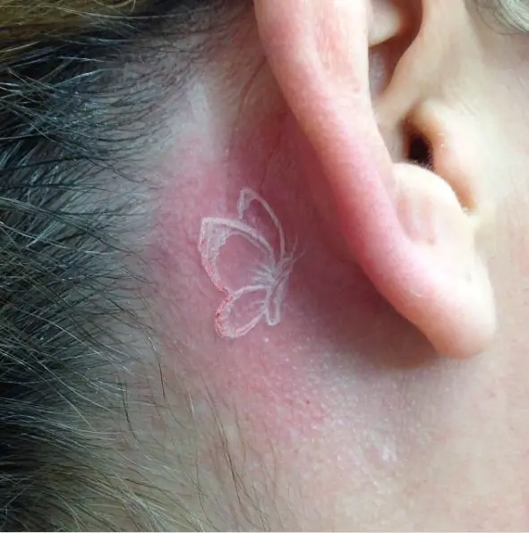 White Butterfly Tattoo Behind the Ear