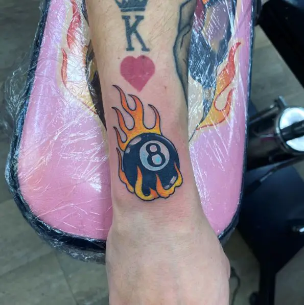 Yellow Flames with Black 8 Ball Wrist Tattoo