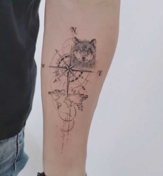 World Map with Compass and Wolf Forearm Tattoo