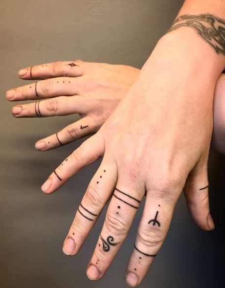 Stars and Symbols Knuckles Tattoo