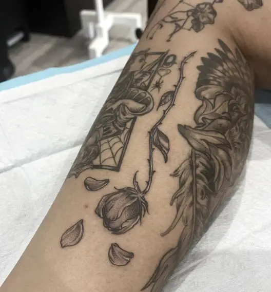 Falling Petals from Dead Rose Leg Tattoo