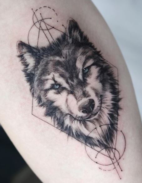 Realistic Wolf with Blue Eyes Arm Tattoo