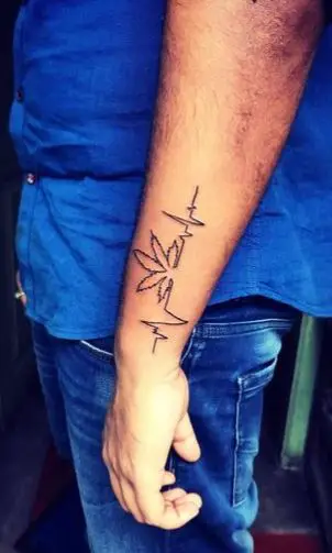 Electrocardiogram and Marijuana Leaf Forearm Tattoo
