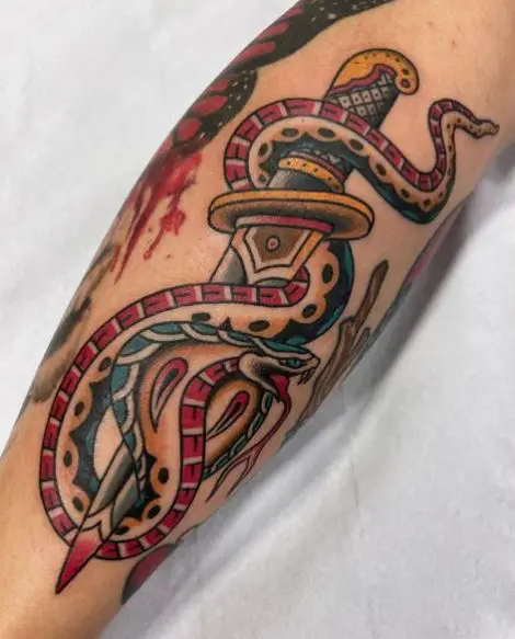 Colored Dagger and Cobra Snake Forearm Tattoo