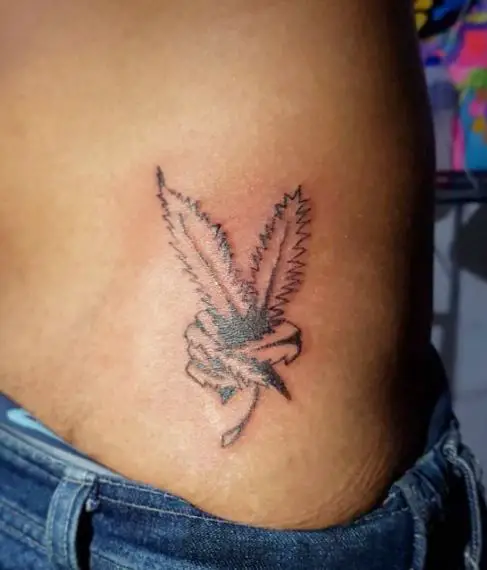 Marijuana Leaf as Peace Sign Belly Tattoo