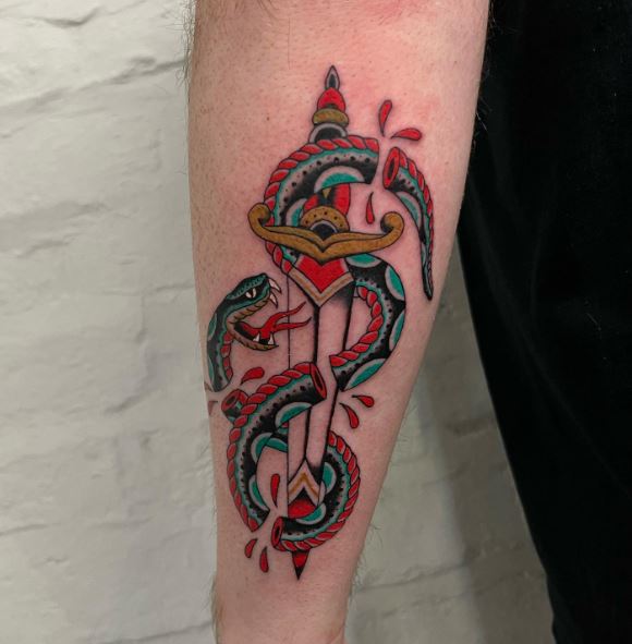 Colored Dagger and Severed Snake Arm Tattoo