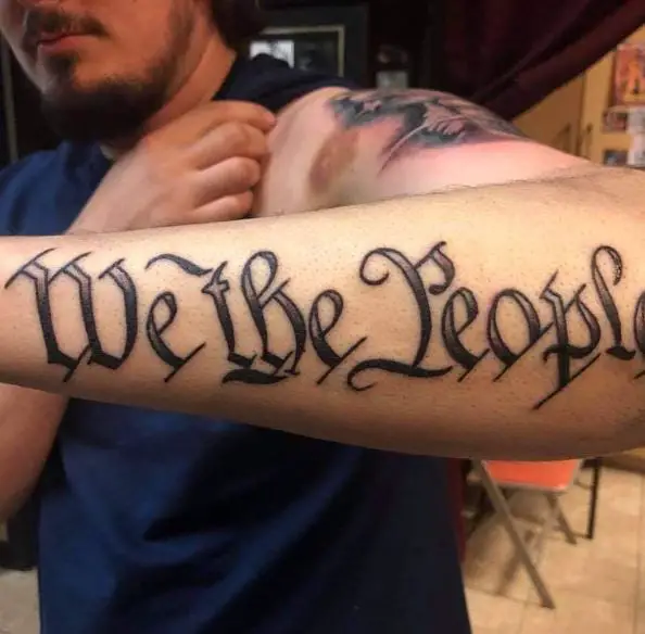 Black and Grey Letters We the People Forearm Tattoo