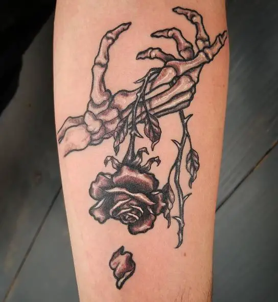 Skeleton Hand and Dead Rose Arm Tattoo