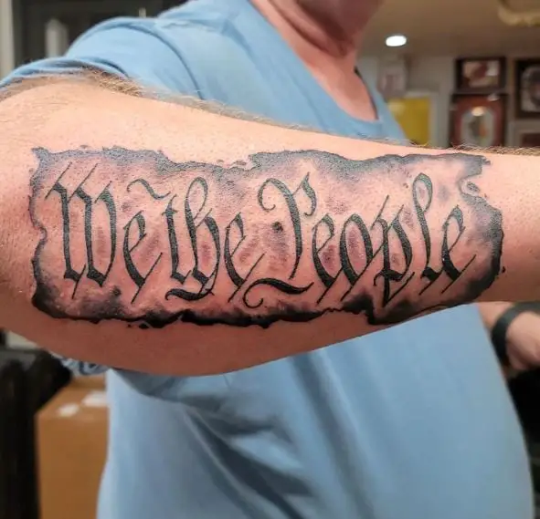 Grey Background We the People Forearm Tattoo