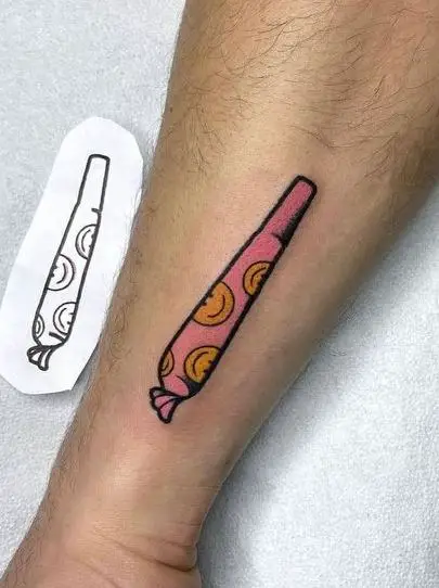 Joint with Smiley Face Emoji Arm Tattoo
