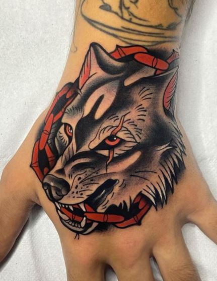 Chain and Wolf Hand Tattoo