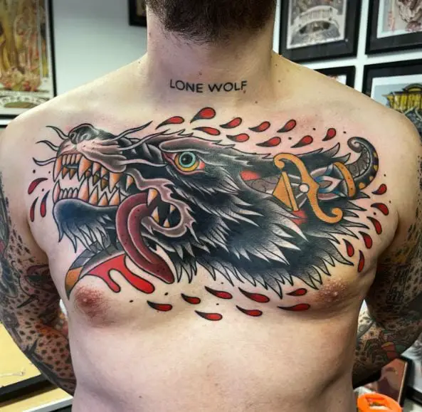 Dagger Stabbed in Wolf Head Chest Tattoo