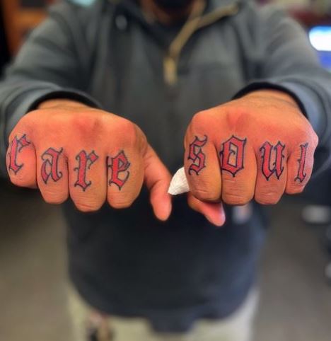 Red Bold Lettering Knuckle Tattoo