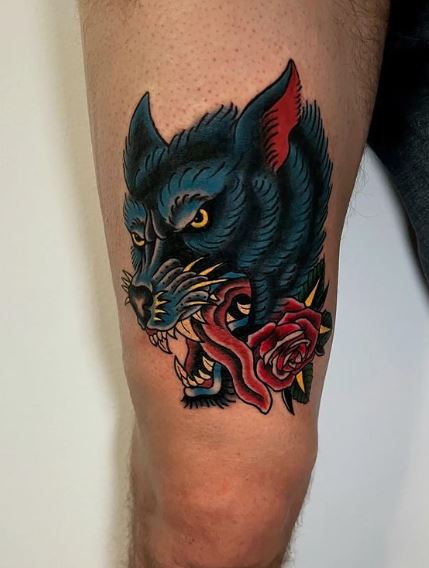 Red Rose and Wolf Thigh Tattoo