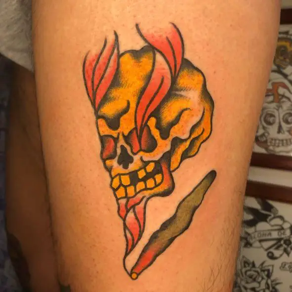 Skull and Burning Joint Thigh Tattoo