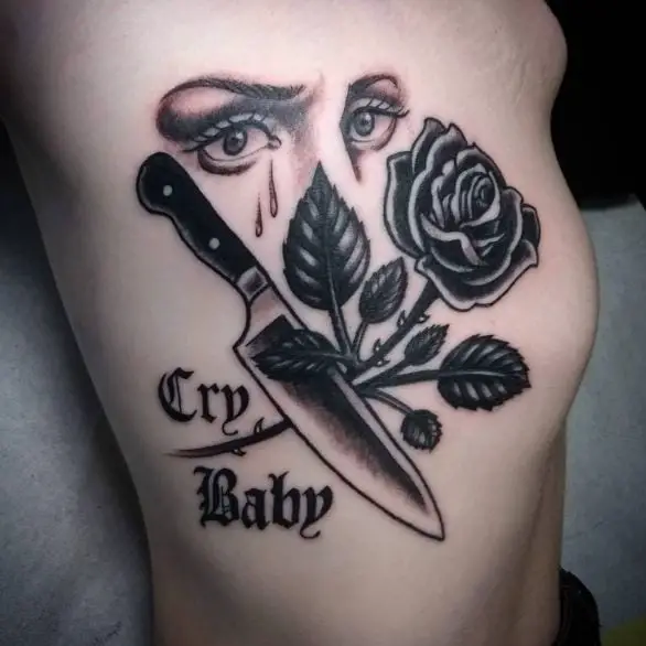 Crying Eyes and Rose with Knife Ribs Tattoo