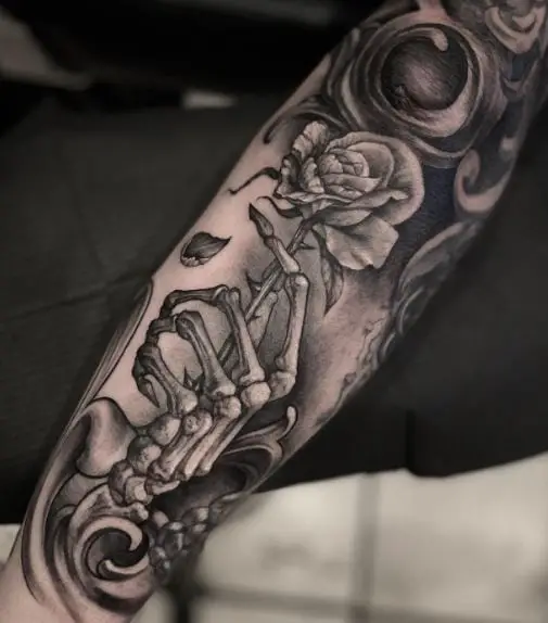 Skeleton Hand and Dead Rose Forearm Tattoo