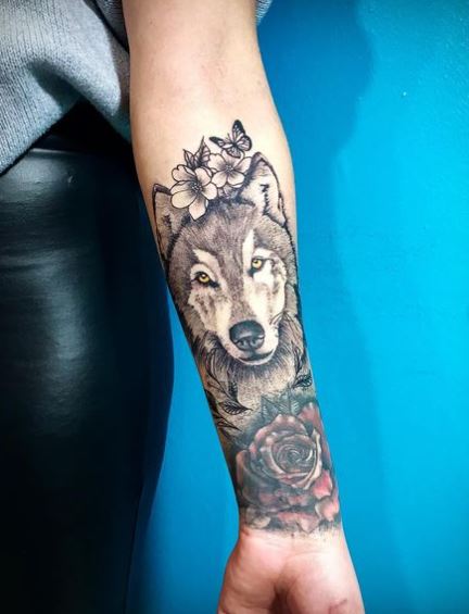 Flowers and Wolf Head Forearm Tattoo