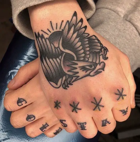 Black Stars and Letters Knuckles Tattoo