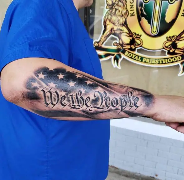 Stars and We the People Forearm Tattoo