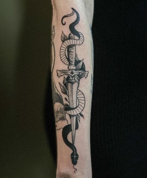 Black and Grey Snake and Dagger with Leaves Forearm Tattoo