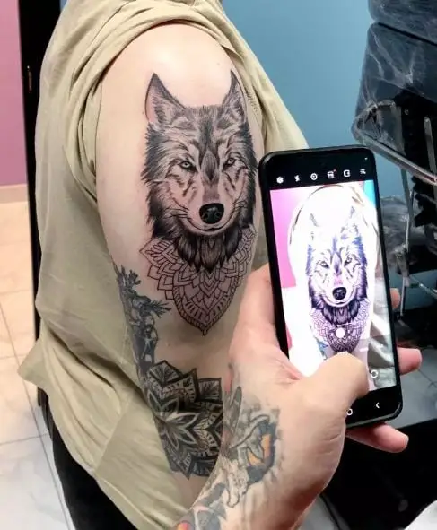 Mandala Ornament and Wolf Head Arm Tattoo