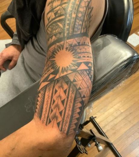Sun and Samoan Tribal Arm Tattoo