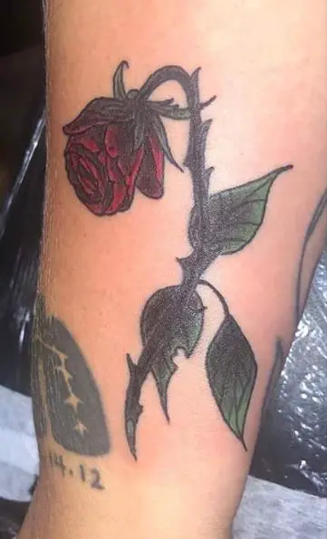 Dying Red Rose with Thorns and Leaves Tattoo