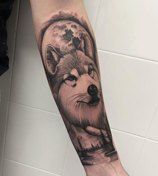 Night Landscape and Wolf Head Forearm Tattoo