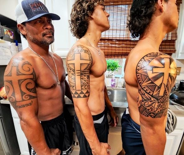 Cross and Samoan Tribal Arm Tattoos