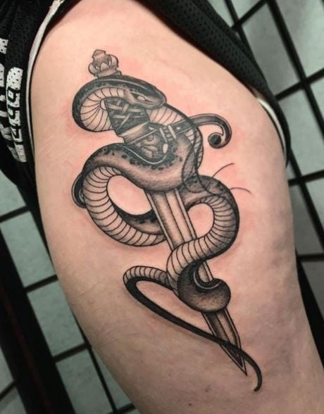 Black and Grey Snake and Dagger Hip Tattoo