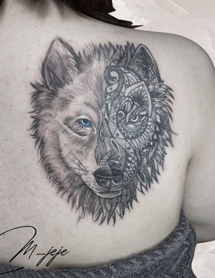 Half Ornamented Wolf Head Back Tattoo