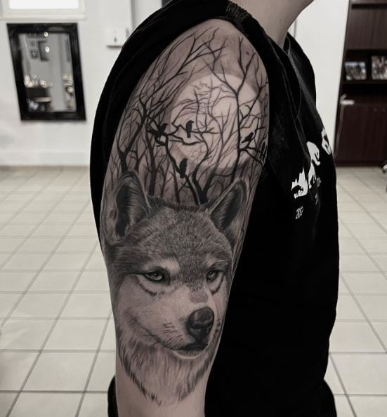 Trees with Birds and Wolf Head Arm Tattoo