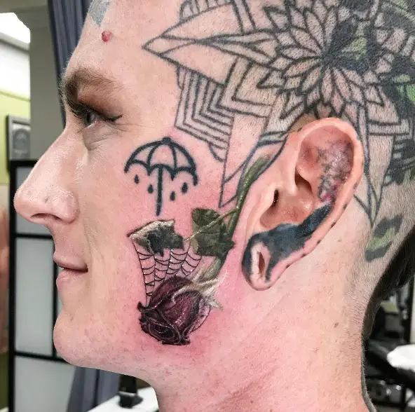 Spider Web and Dead Red Rose Cheek Tattoo
