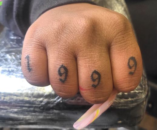 Black 1999 Knuckles Tattoo