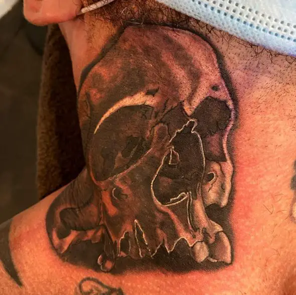 Black and Grey Skull Neck Tattoo