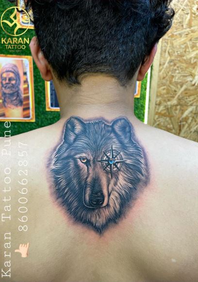 Black and Grey Wolf Head with Compass Back Tattoo