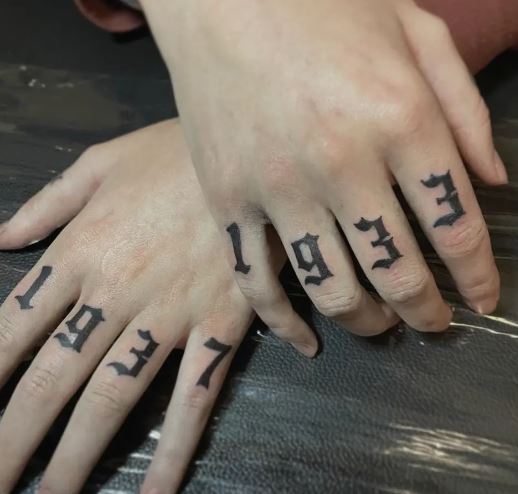 Black Bold Numbers Knuckles Tattoo