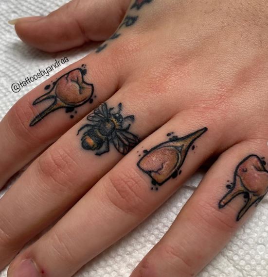 Bee and Teeth Knuckles Tattoo