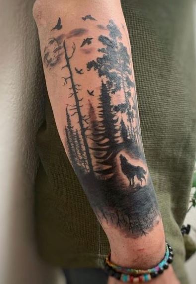 Forest with Birds and Howling Wolf Arm Tattoo