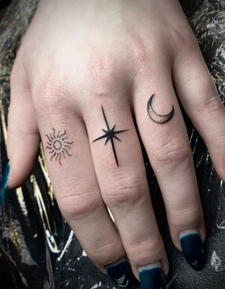 Sun with Moon and Star Knuckles Tattoo