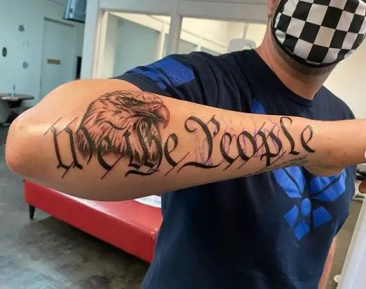 Black and Grey Eagle and We The People Forearm Tattoo