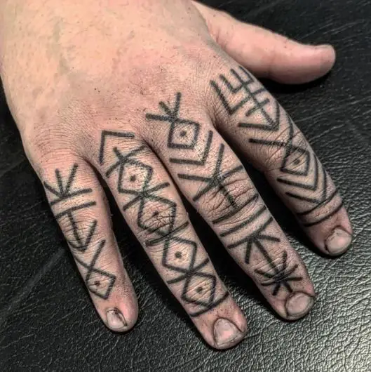 Ornamental Symbols Knuckles Tattoo