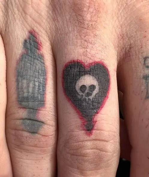 Skull in Heart Knuckles Tattoo