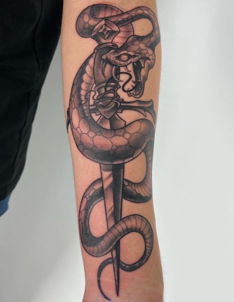 Shaded Snake and Dagger Arm Tattoo