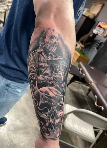 Skull and Jason with Axe Forearm Tattoo